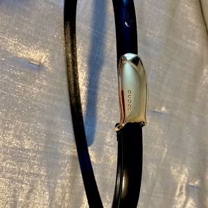 Gucci black skinny belt with gold buckle. Size XS.